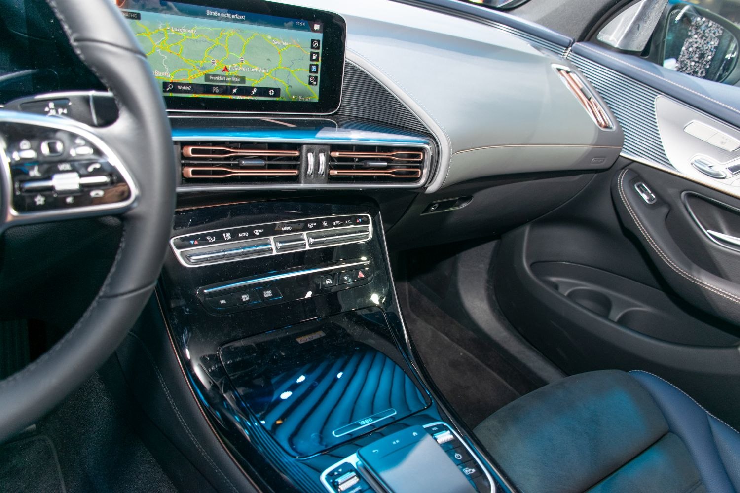 Digital navigation display and climate controls in luxury car interior