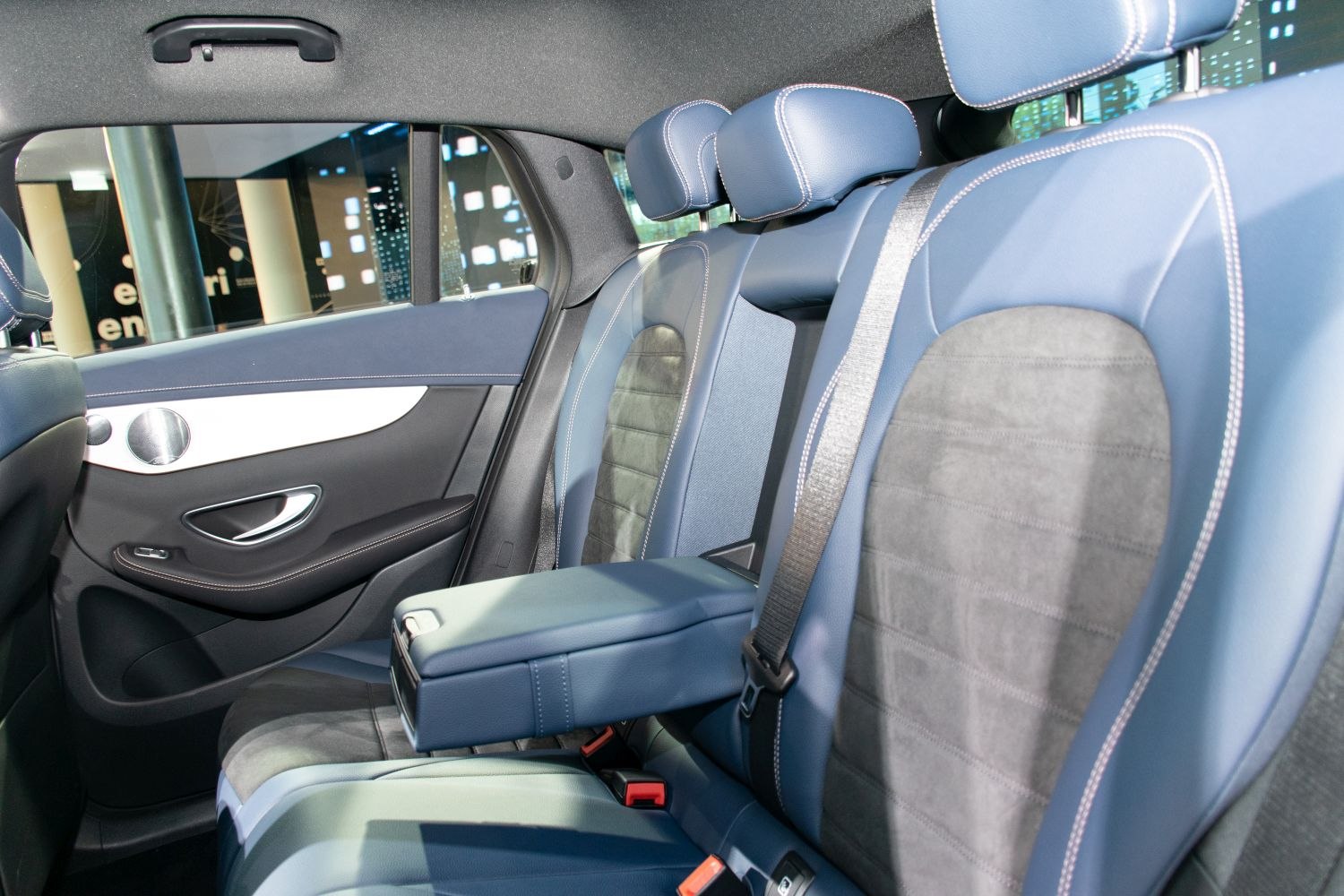 Rear seat interior with leather upholstery and center armrest