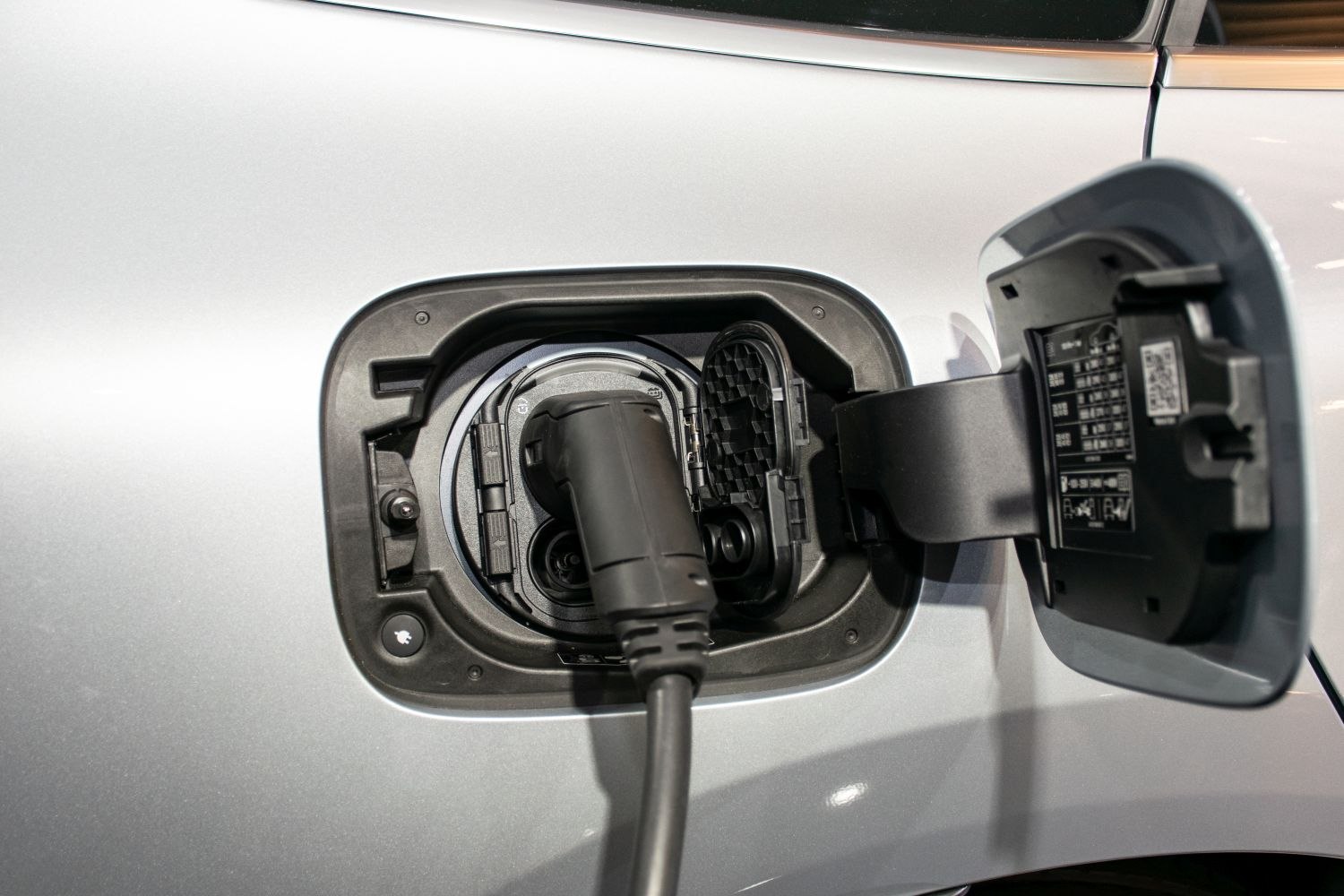 Electric vehicle charging port with plug connected