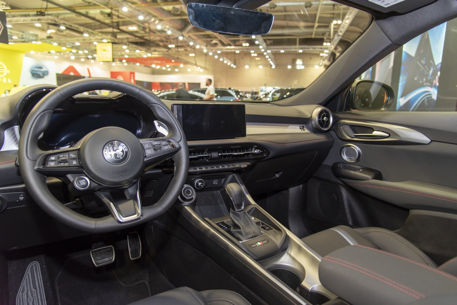 Digital dashboard, multifunction steering wheel, center console with infotainment screen