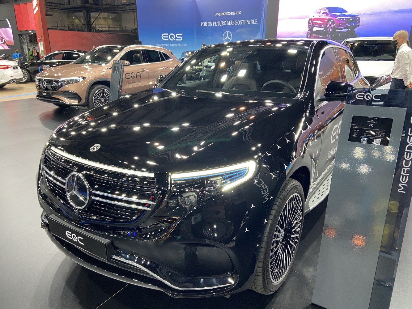 Black electric SUV front-side view with LED headlights and stylish multi-spoke wheels