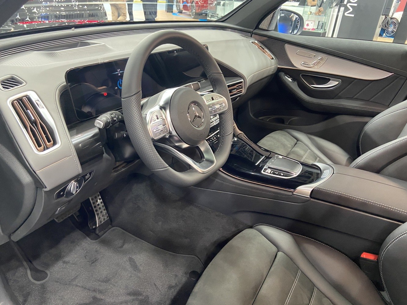 Digital instrument cluster and multifunction steering wheel in luxury car interior
