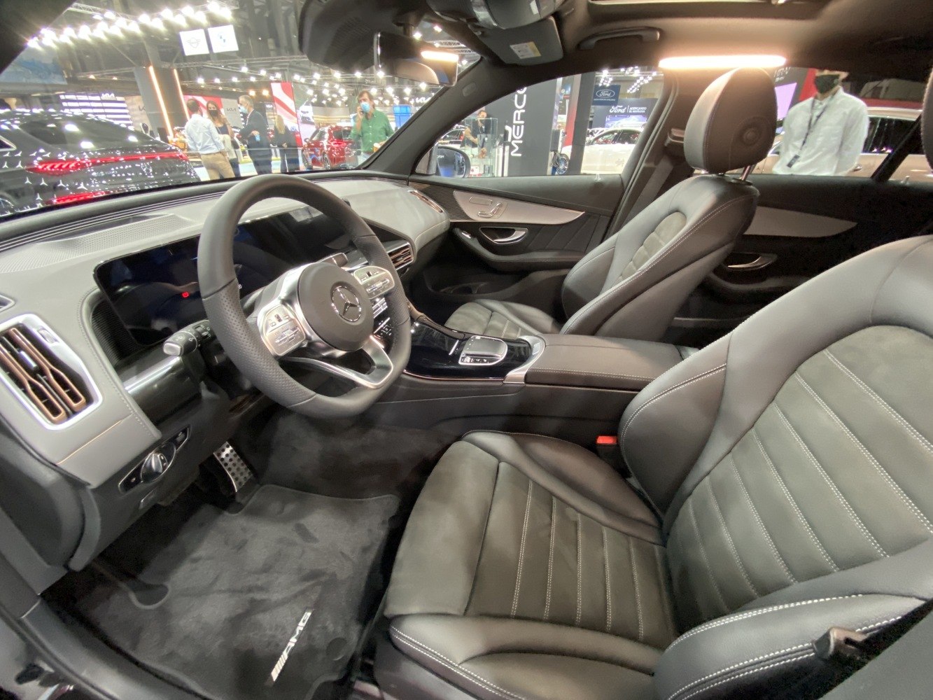 Modern digital cockpit and luxury leather seats inside vehicle