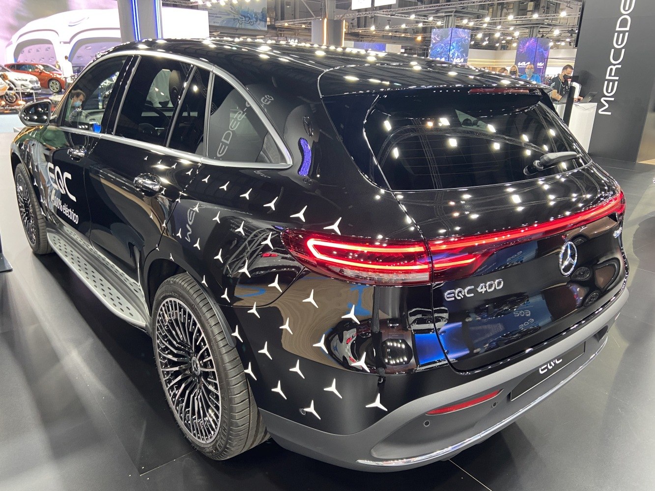 Rear-side view of electric SUV with distinctive taillights and alloy wheels