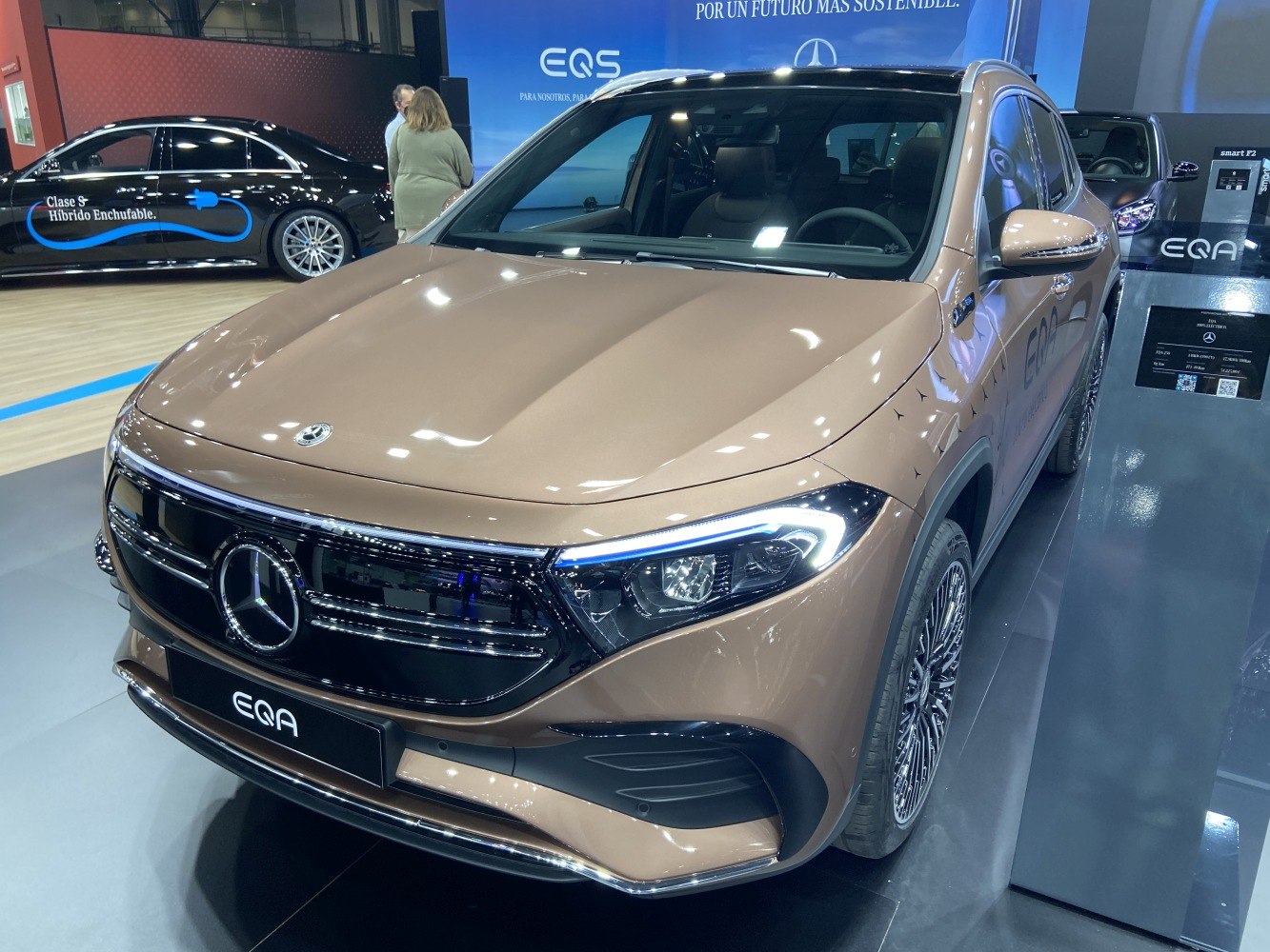 Front view of an electric SUV with LED headlights and prominent grille design.