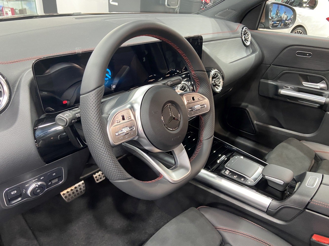 Steering wheel and digital dashboard with central console in luxury car interior