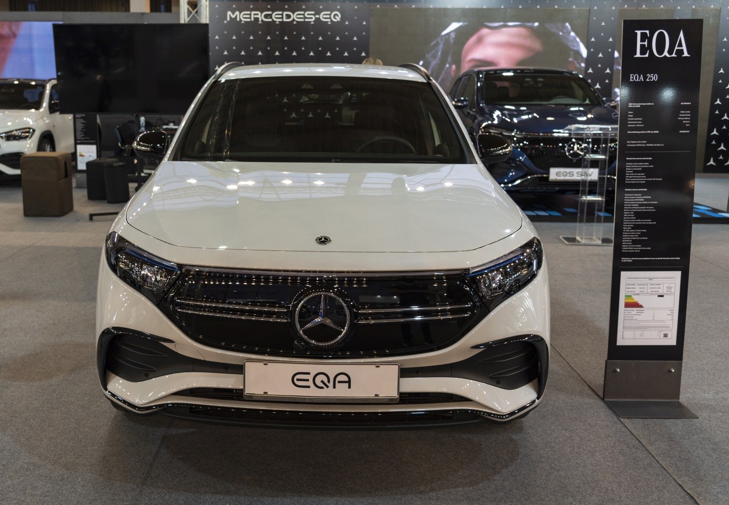 Front view with distinctive grille and sleek headlamp design