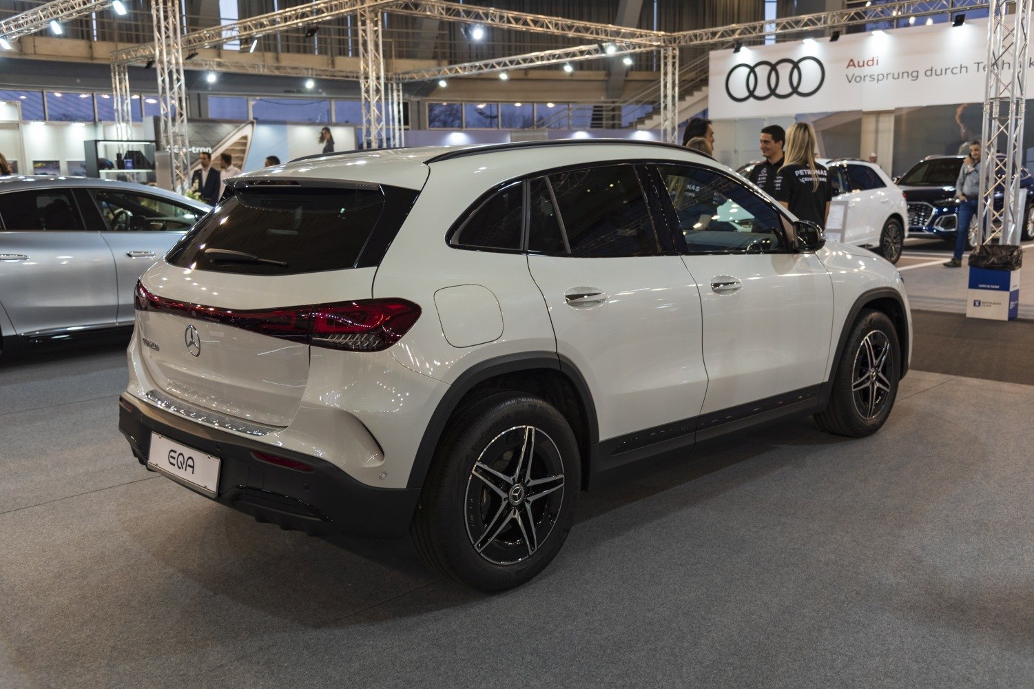 Rear three-quarter view of electric SUV with alloy wheels and tinted windows