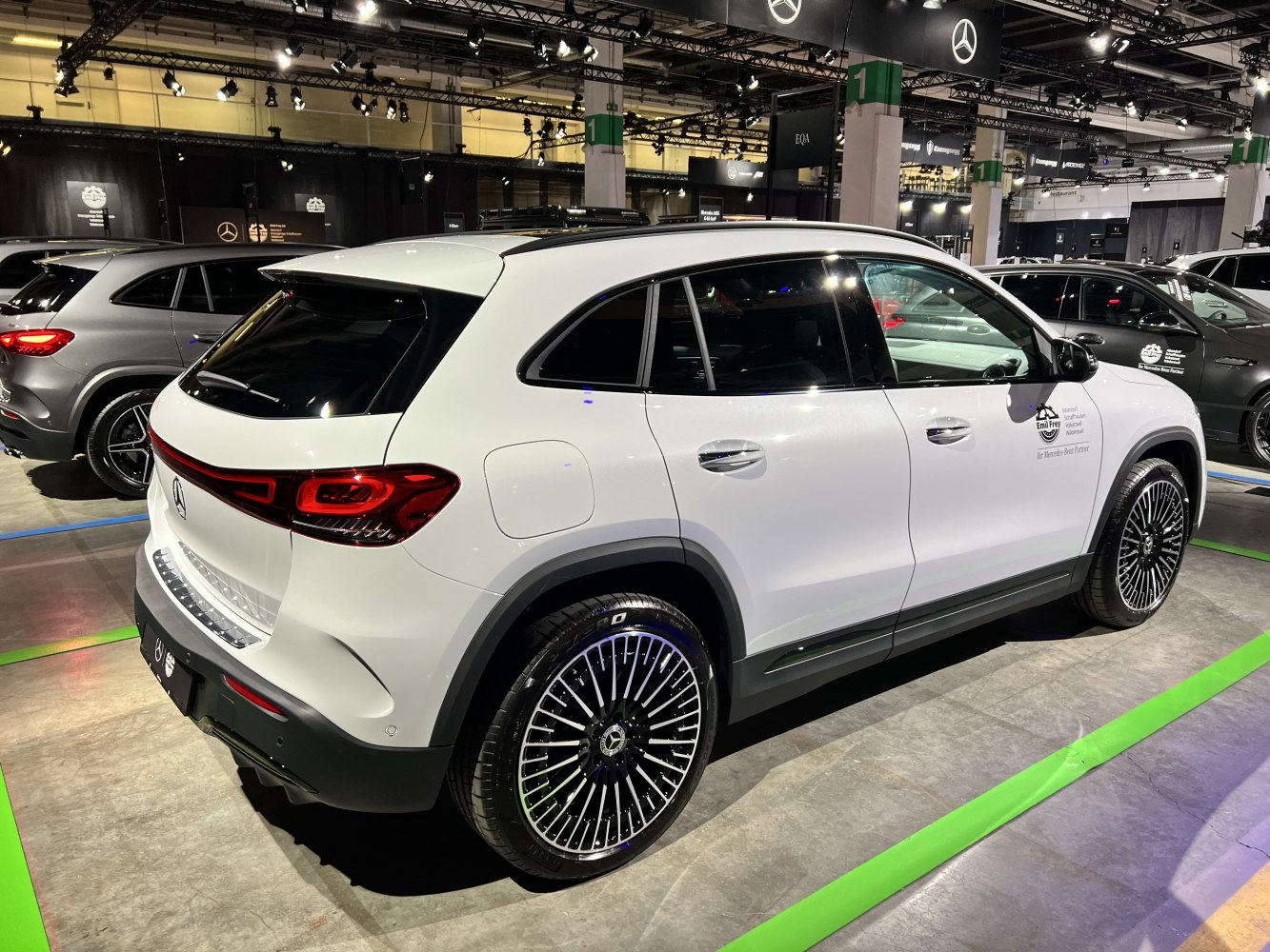 Rear side profile of electric SUV with distinctive alloy wheels and rear lights