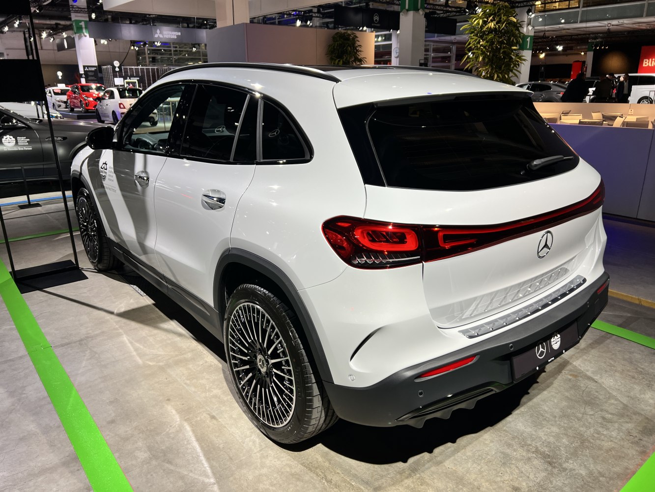 Rear view with sleek taillights and multi-spoke alloy wheels