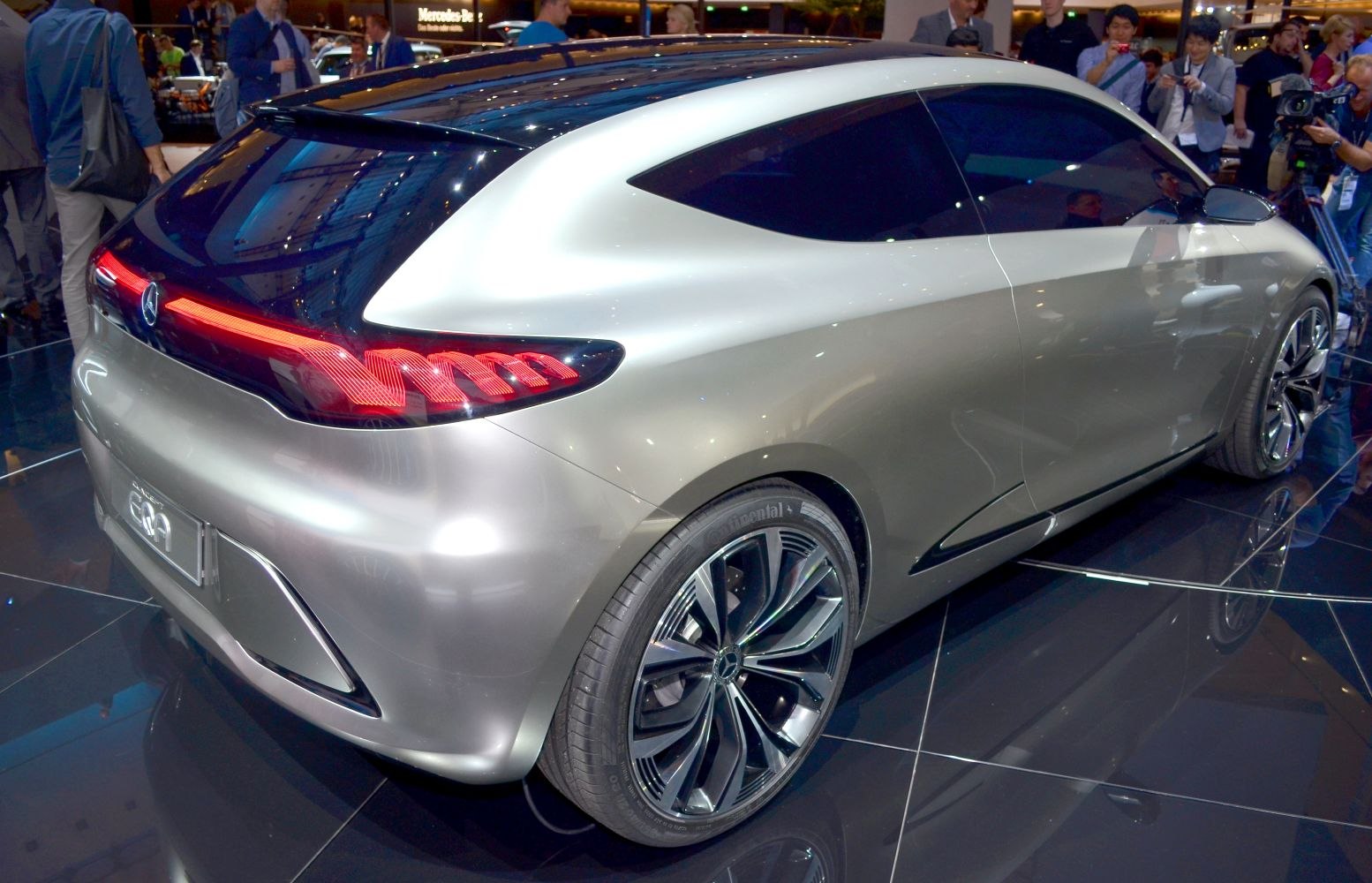 Rear view with integrated LED tail light strip and modern alloy wheel design