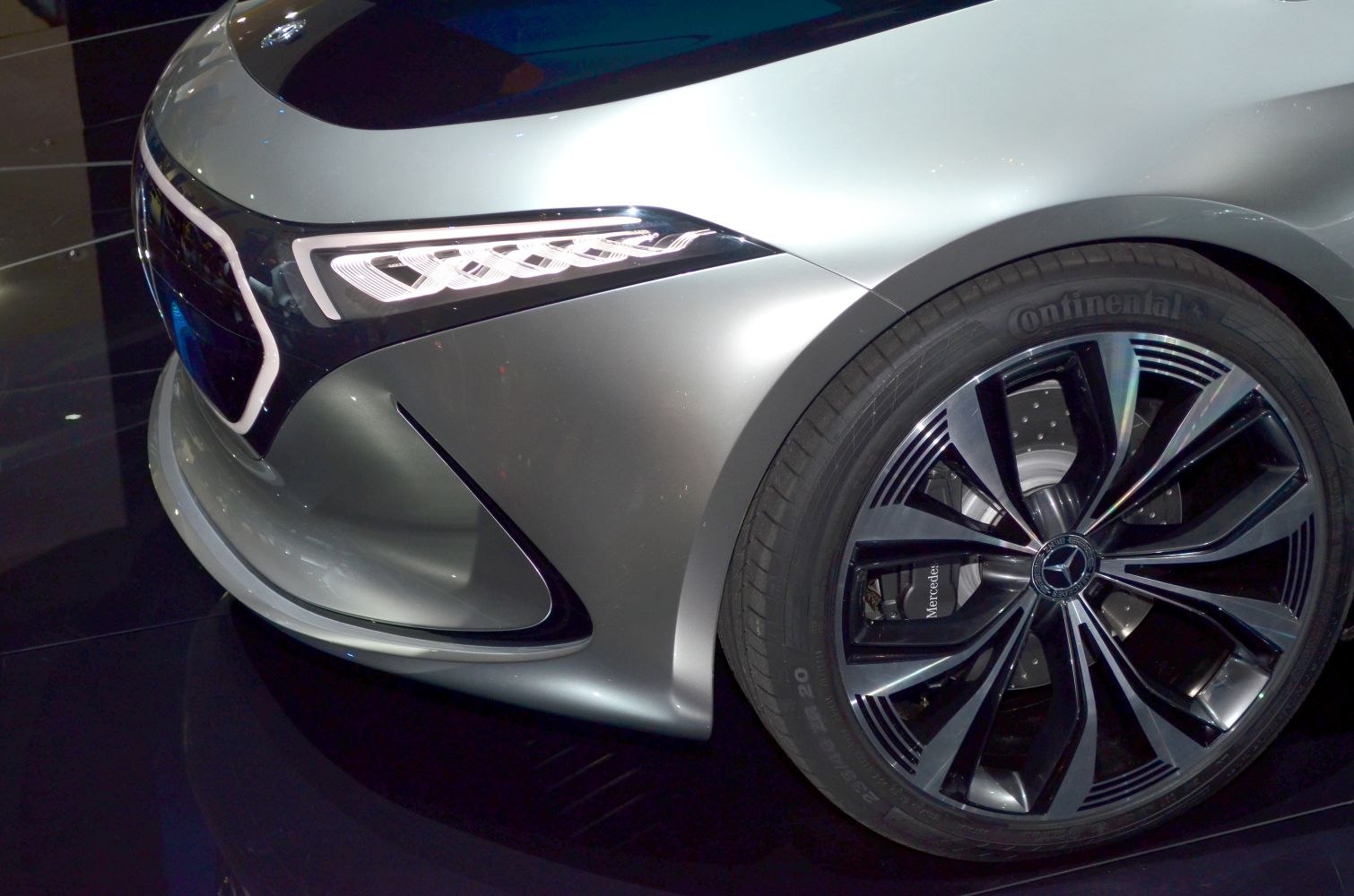 Front headlight and alloy wheel with intricate design and LED lighting