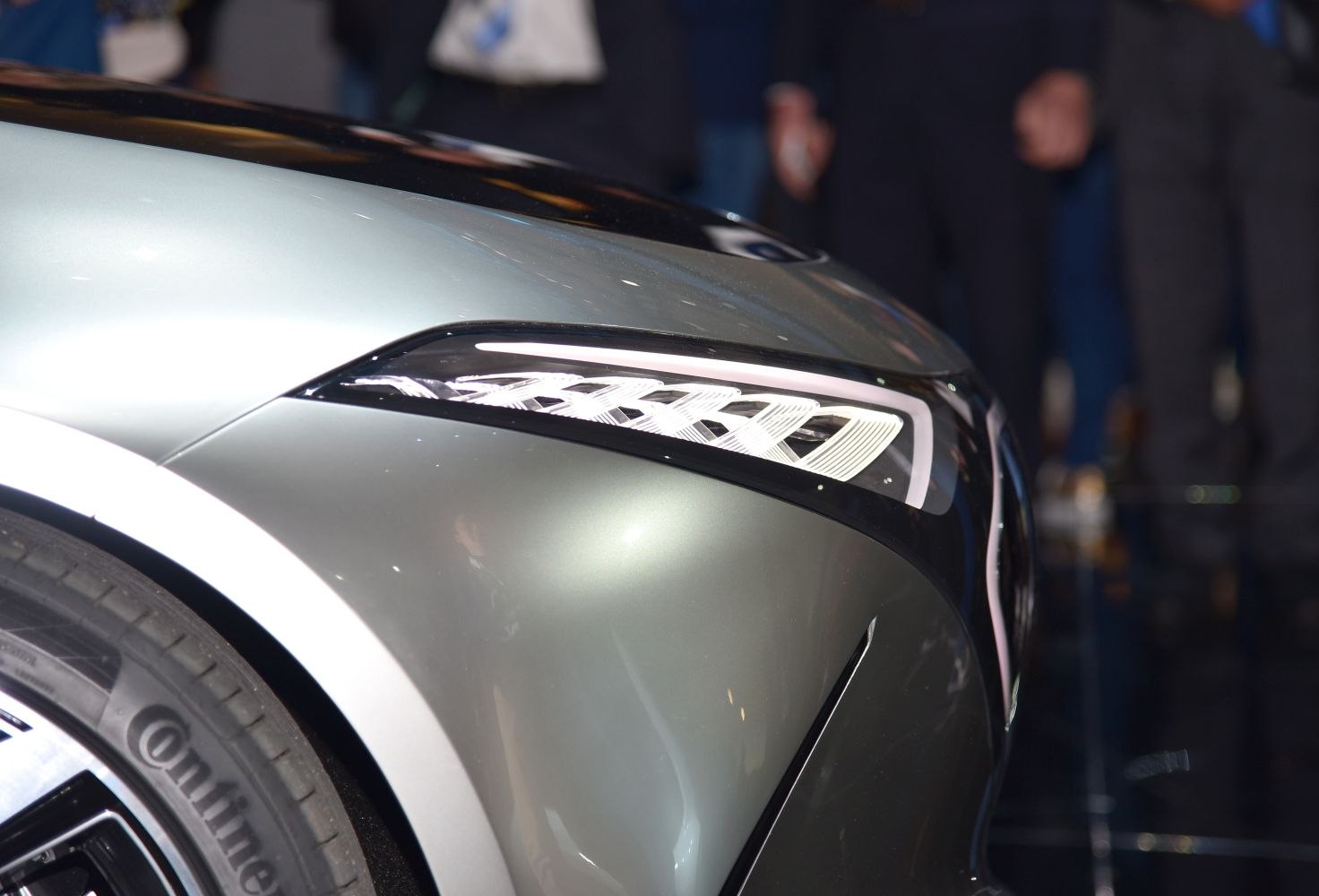 Futuristic headlight and sleek front fender close-up