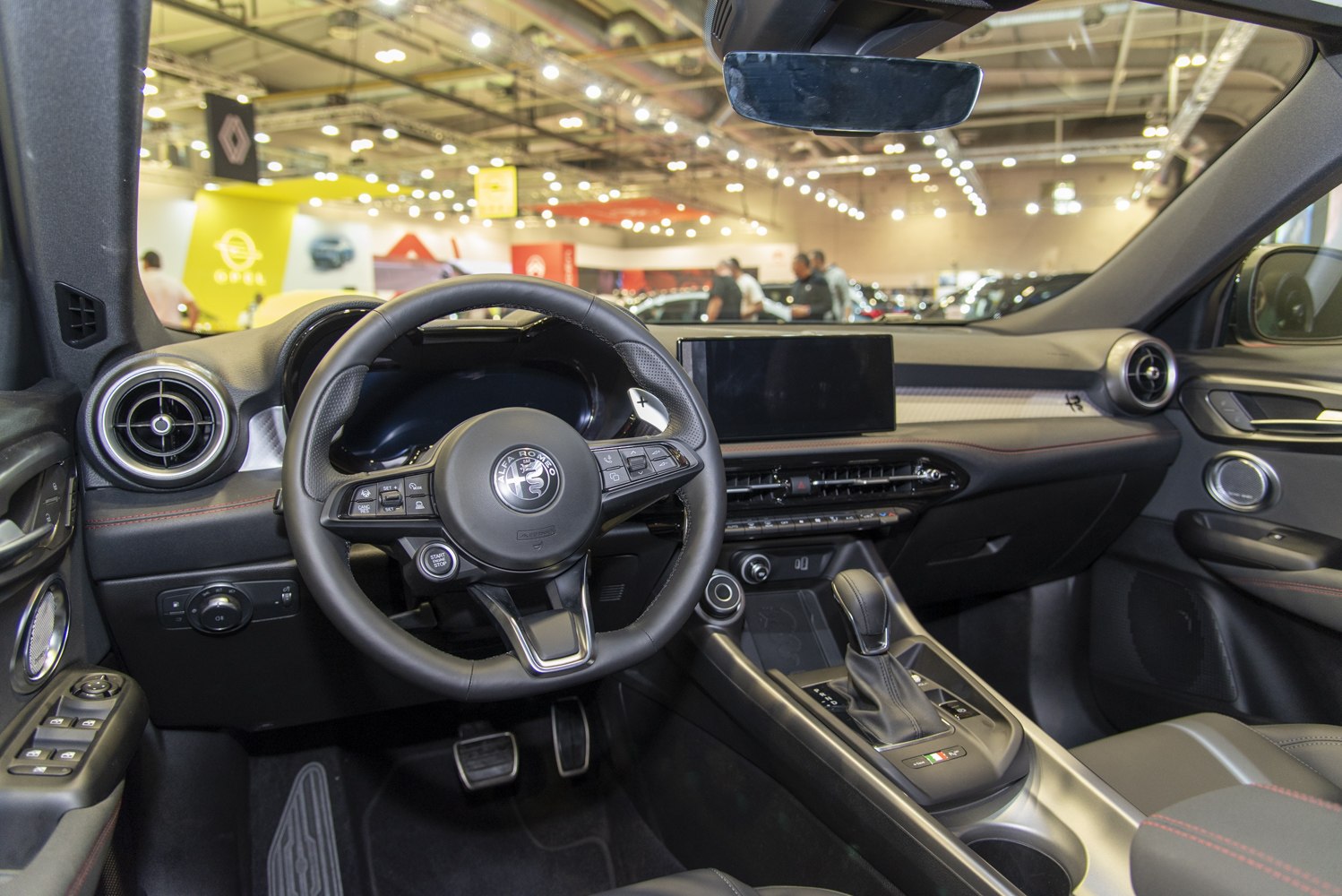 Steering wheel and dashboard with digital display and circular air vents