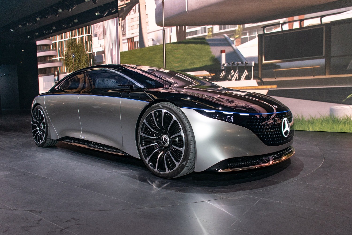 Sleek futuristic electric luxury sedan with aerodynamic design and large wheels