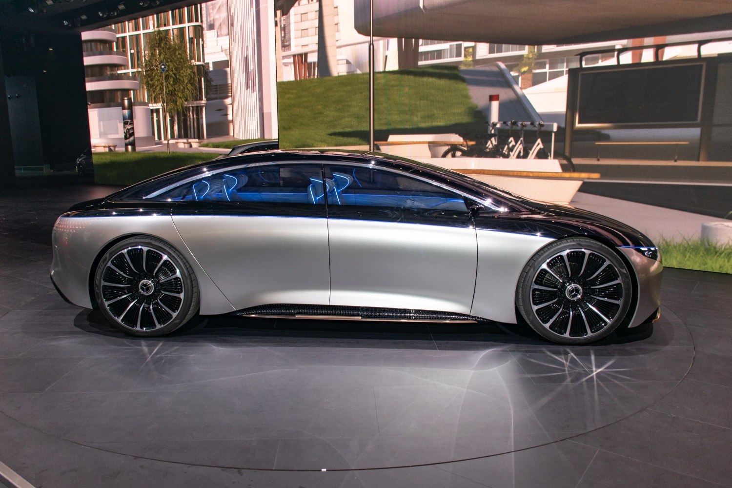 Sleek electric luxury sedan with aerodynamic shape and LED lighting
