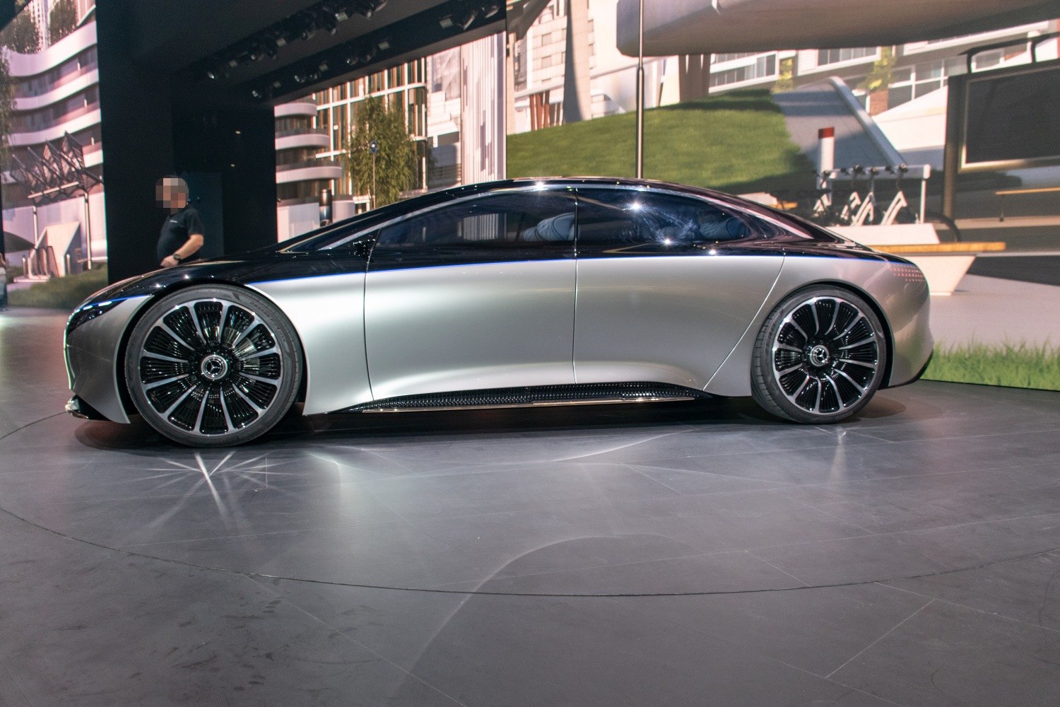 Futuristic luxury electric sedan with aerodynamic design and large distinctive wheels