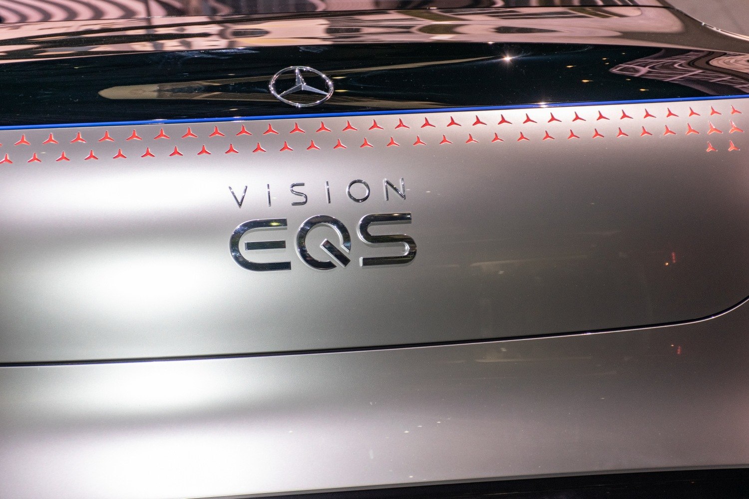 Close-up of rear badge and emblem with illuminated small star pattern