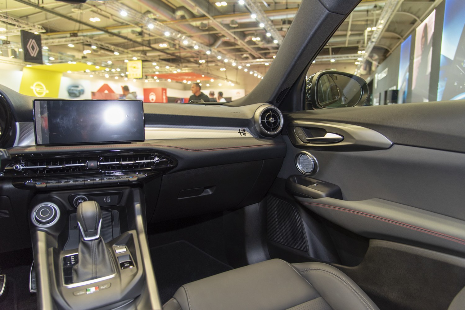 Dashboard and gear shift interior with digital display and air vent