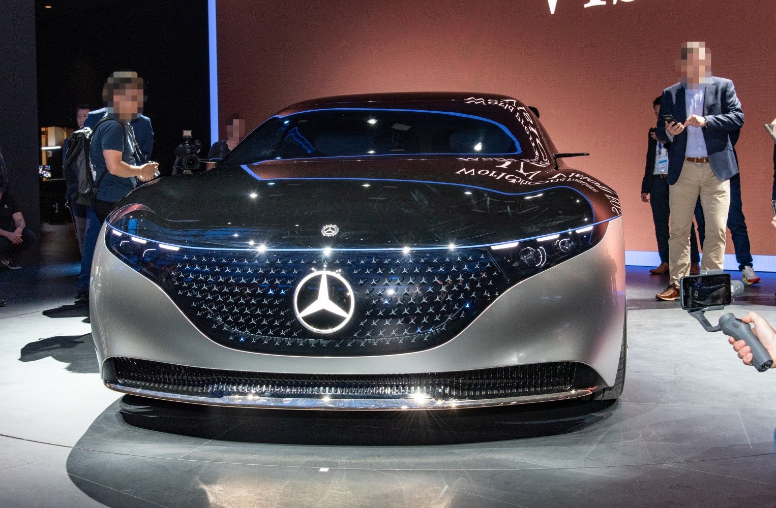 Front view with illuminated grille and sleek LED headlights