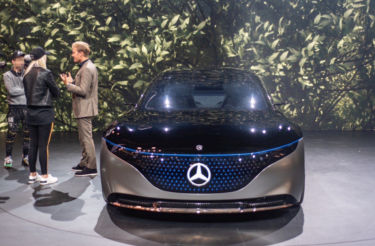 Futuristic front view with illuminated grille and sleek electric design