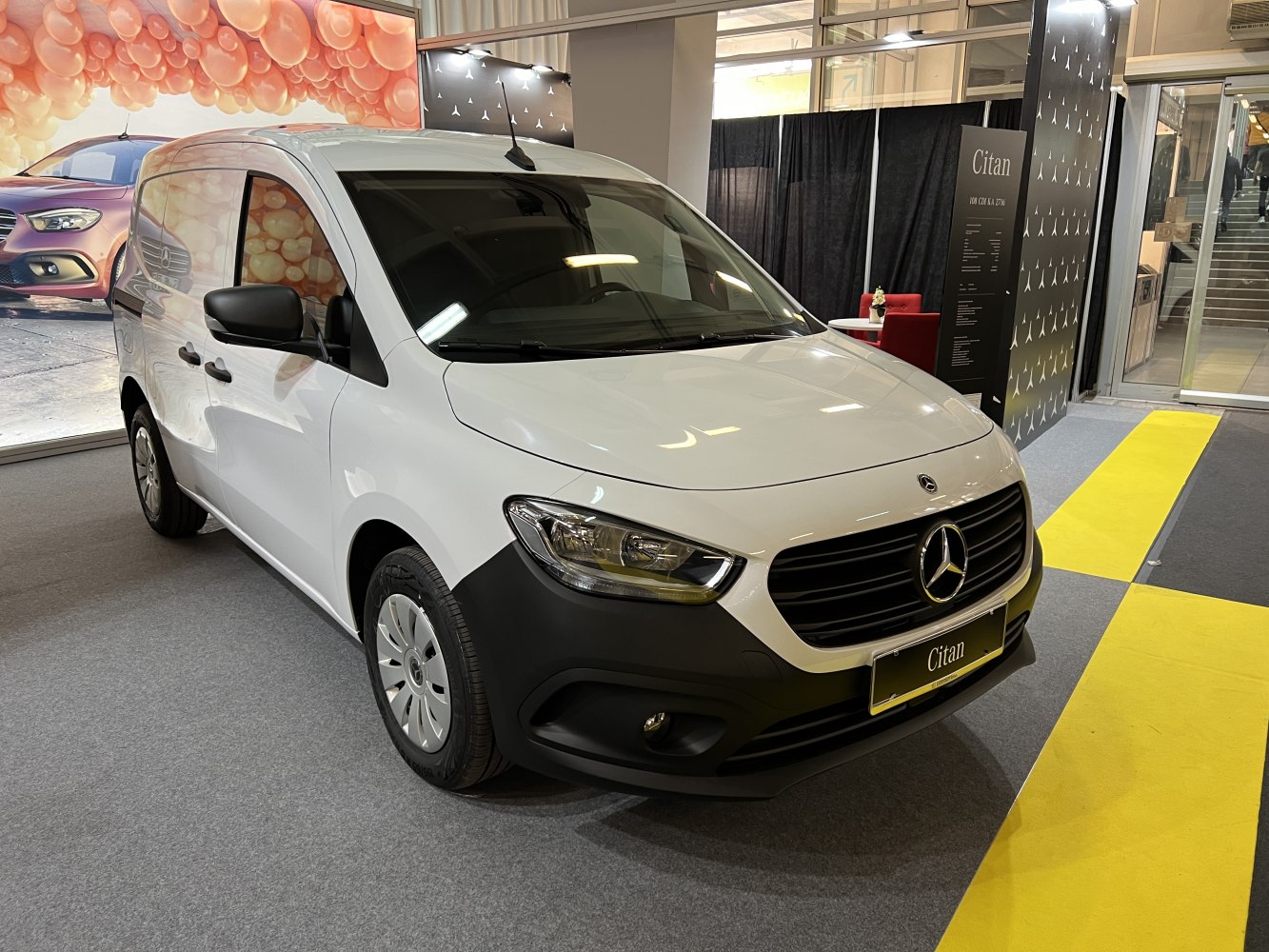 Front view of a white panel van with distinctive grille and headlights