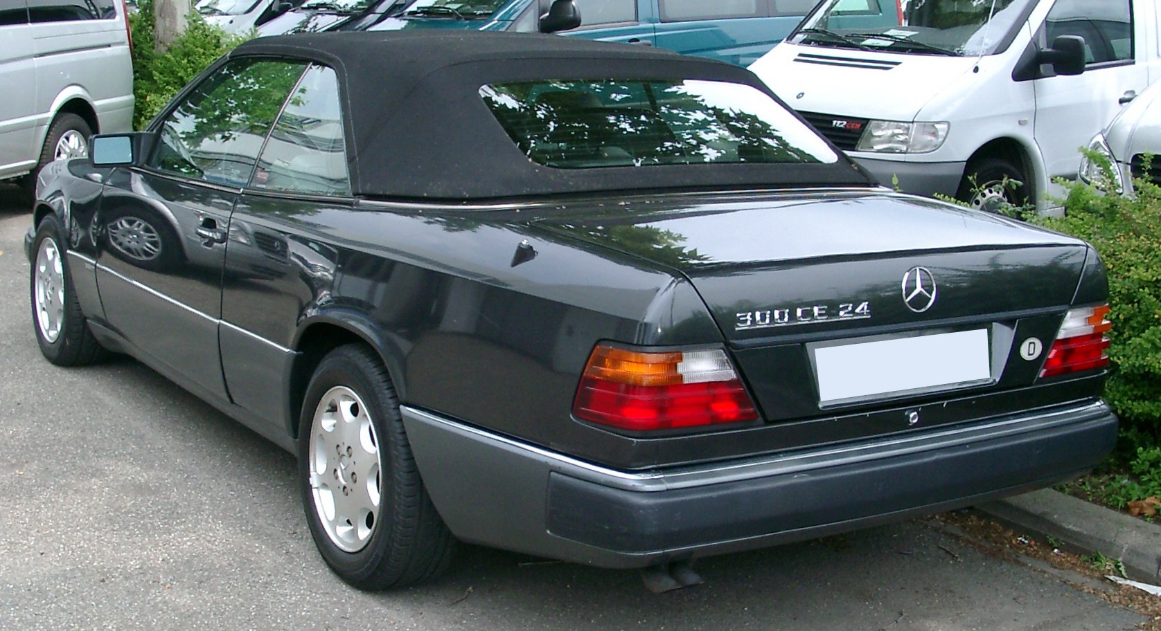 Rear view of convertible with soft fabric roof and alloy wheels
