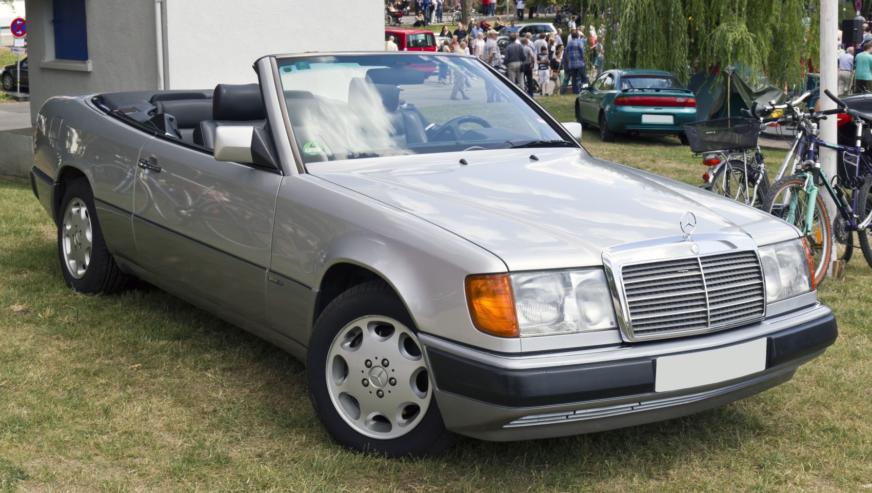 Convertible vehicle showcasing front view with iconic grille and headlamps