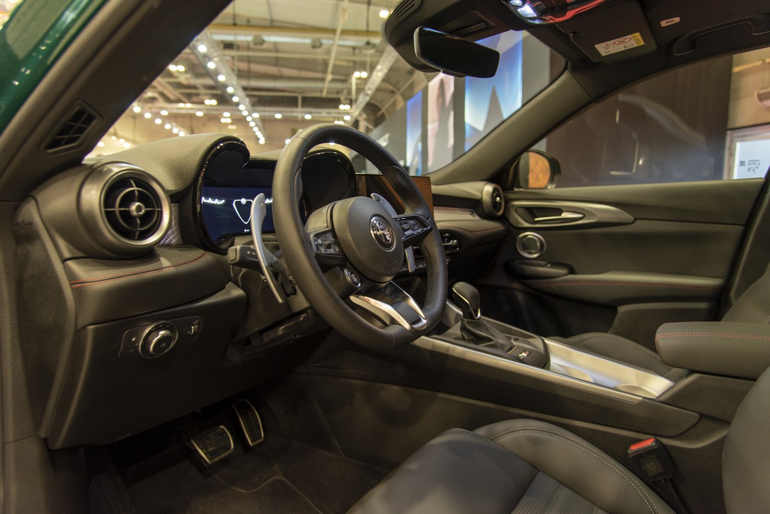 Modern car interior with digital dashboard and steering wheel controls