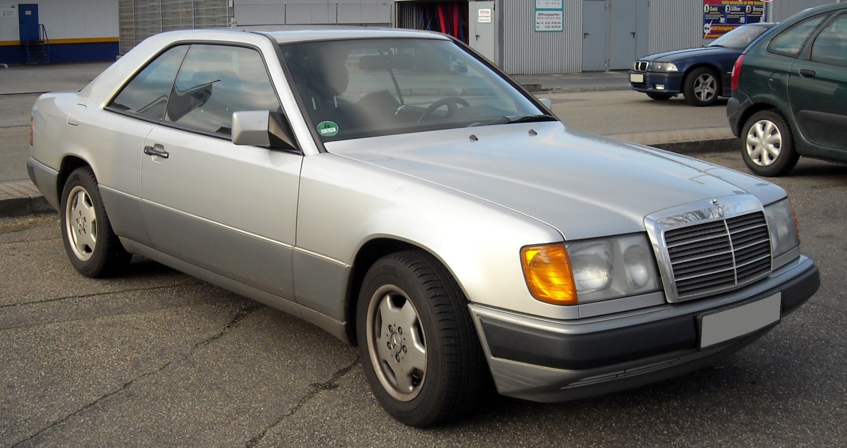 Silver coupe front-side view with classic 1989 design