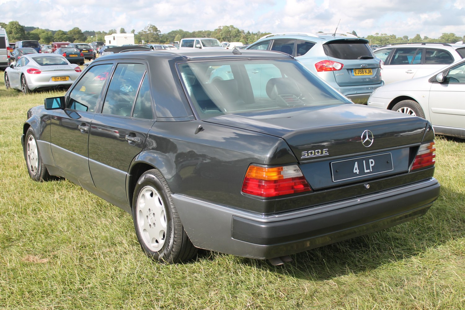 Rear view of a sedan with 500E badge and classic taillights