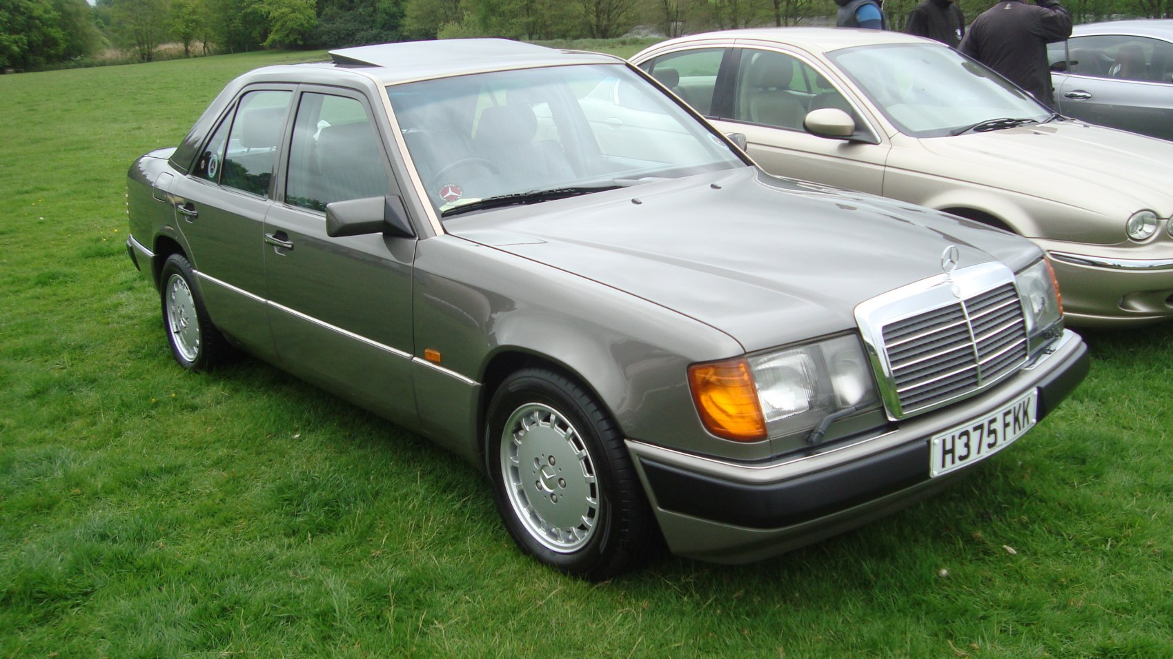 Front side view with alloy wheels and chrome grille
