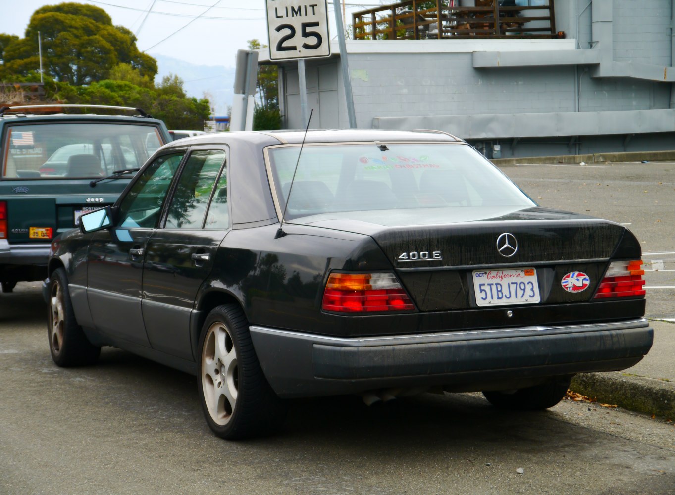 Classic executive sedan rear with distinctive tail lights and external antenna