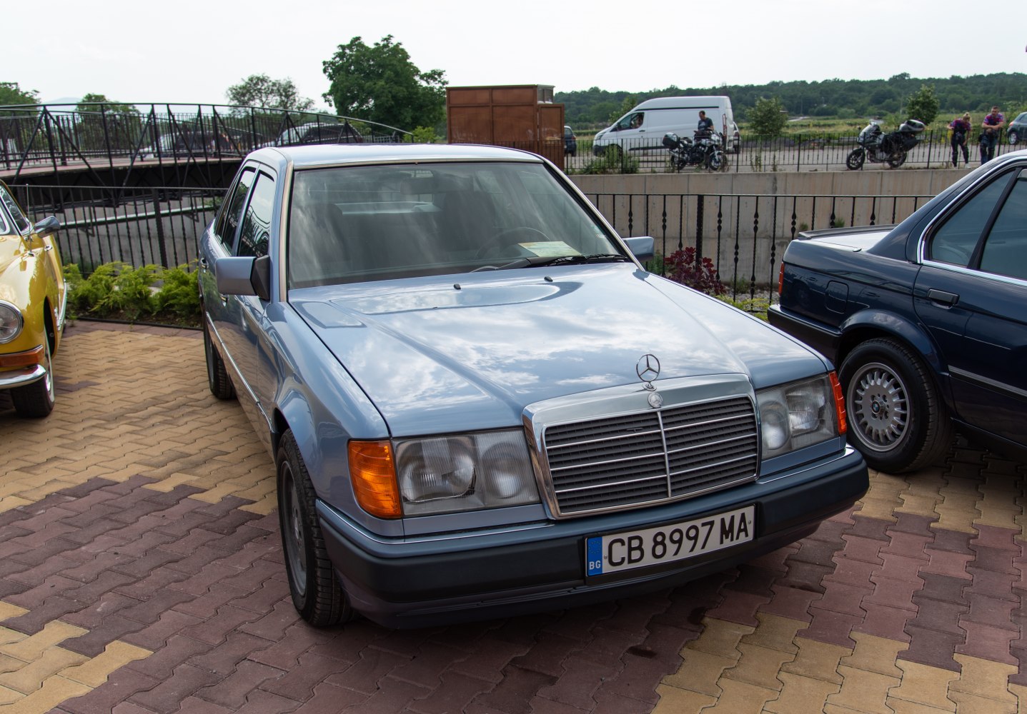 Classic sedan front with chrome grille and dual rectangular headlights