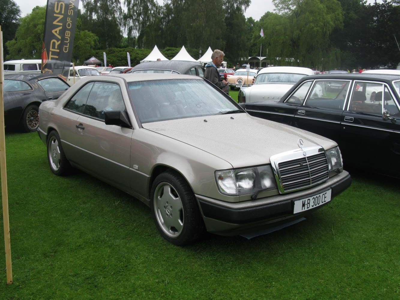 Front side view featuring quad headlights and chrome grille