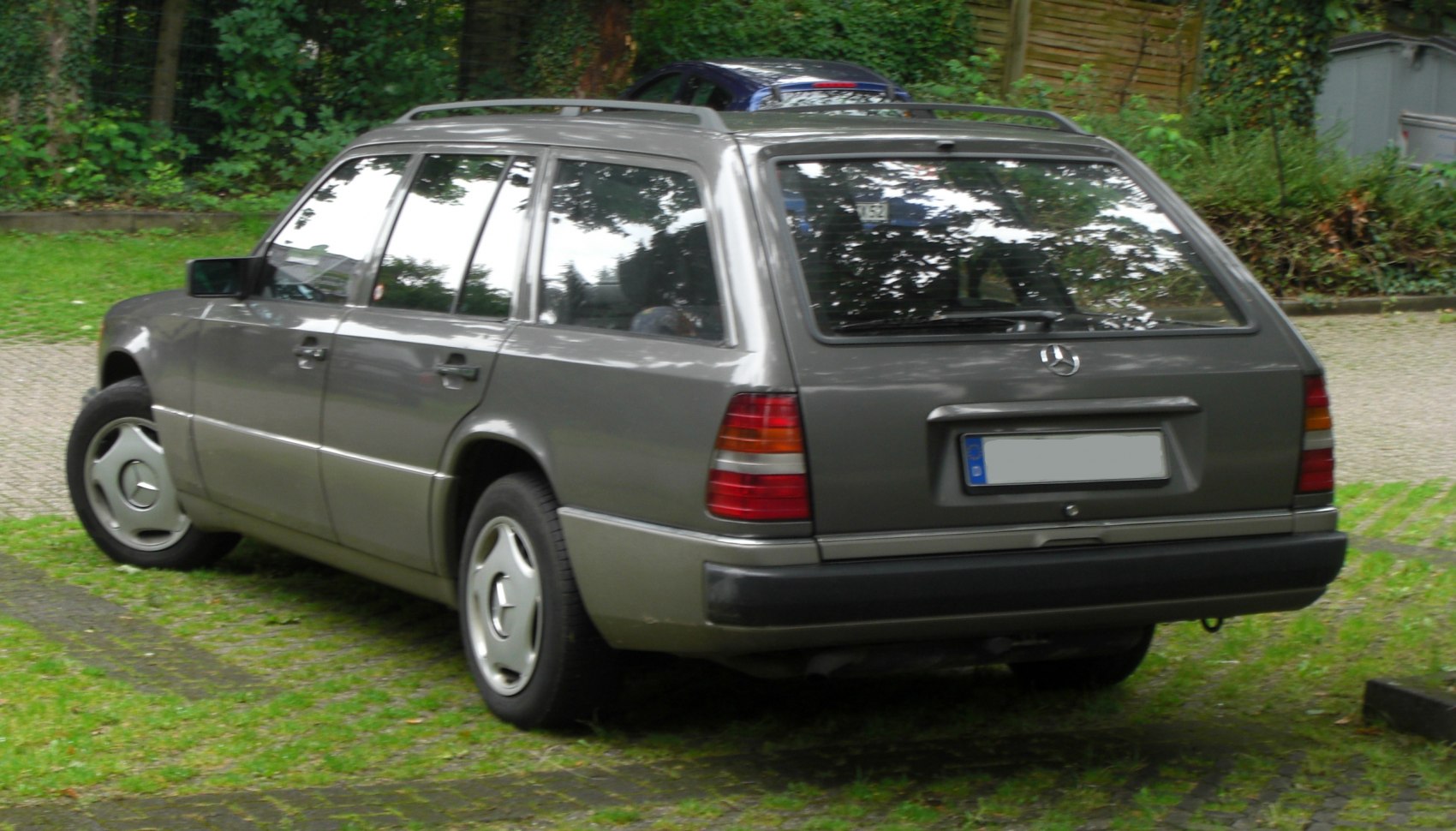 Rear-side view of station wagon with roof rails and classic taillights