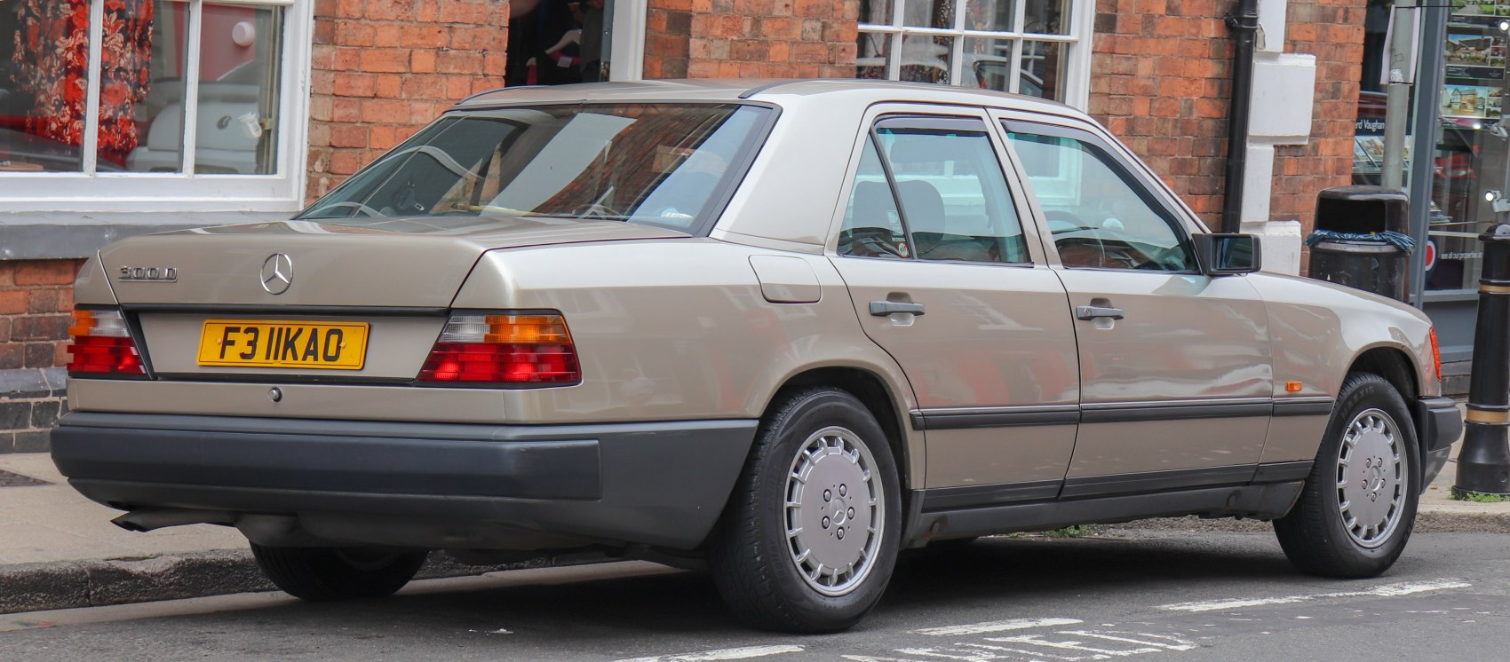 Rear and side view of a classic 1980s mid-size sedan with iconic tail lights and alloy wheels.