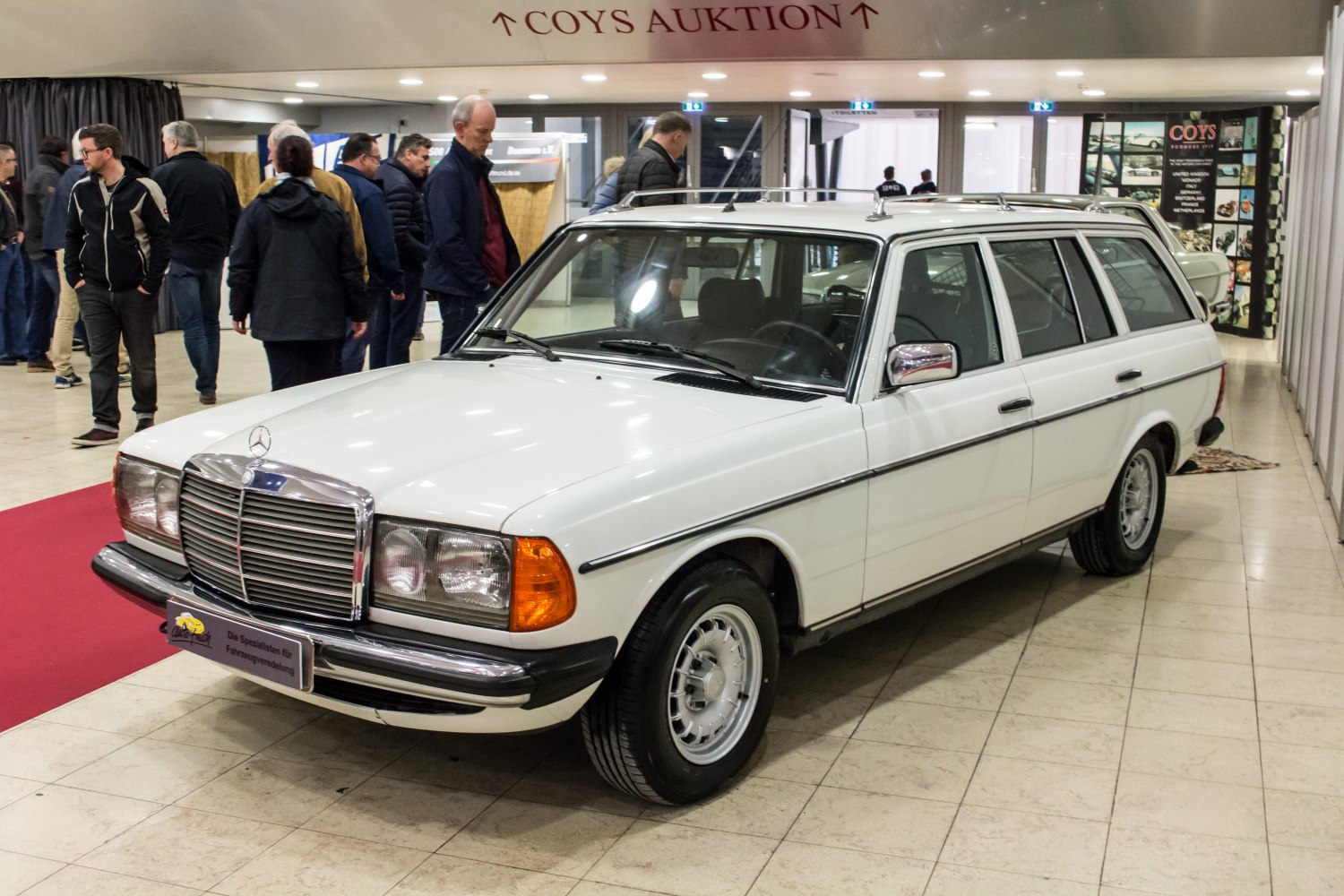 Vintage station wagon with roof rack and chrome grille front