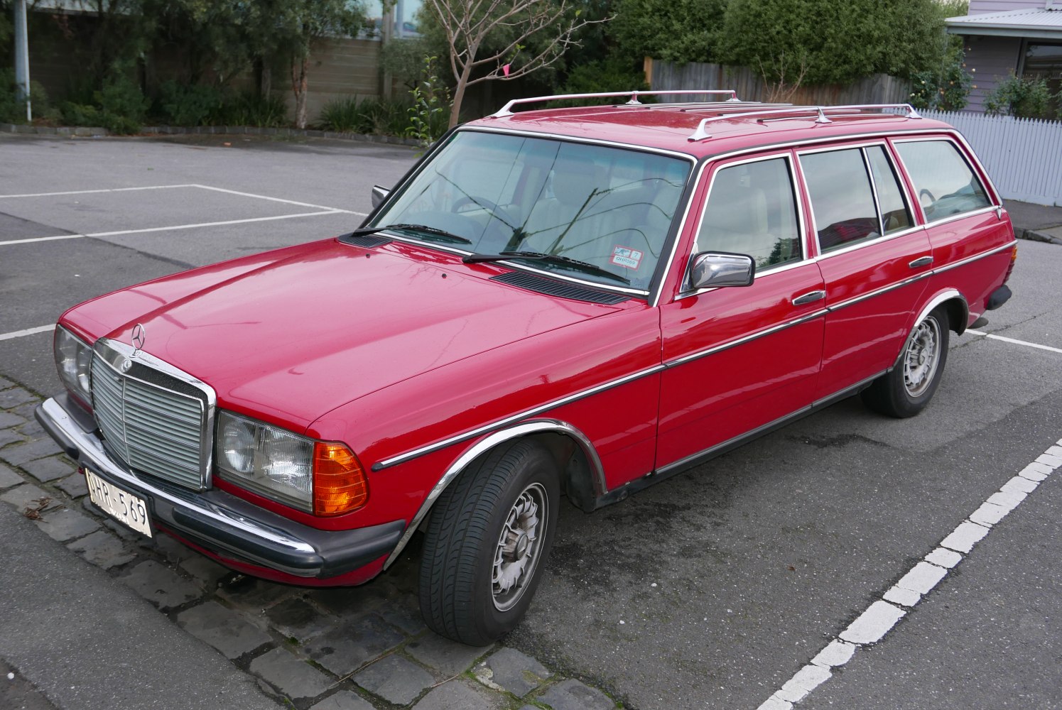 Vintage red wagon with roof rails and chrome trim