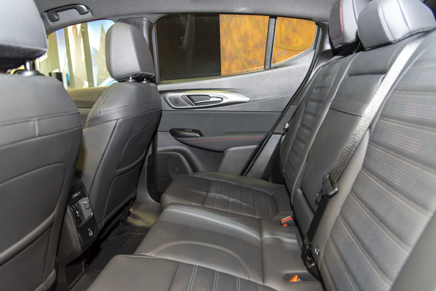 Leather rear seats with detailed stitching and ergonomic door panel