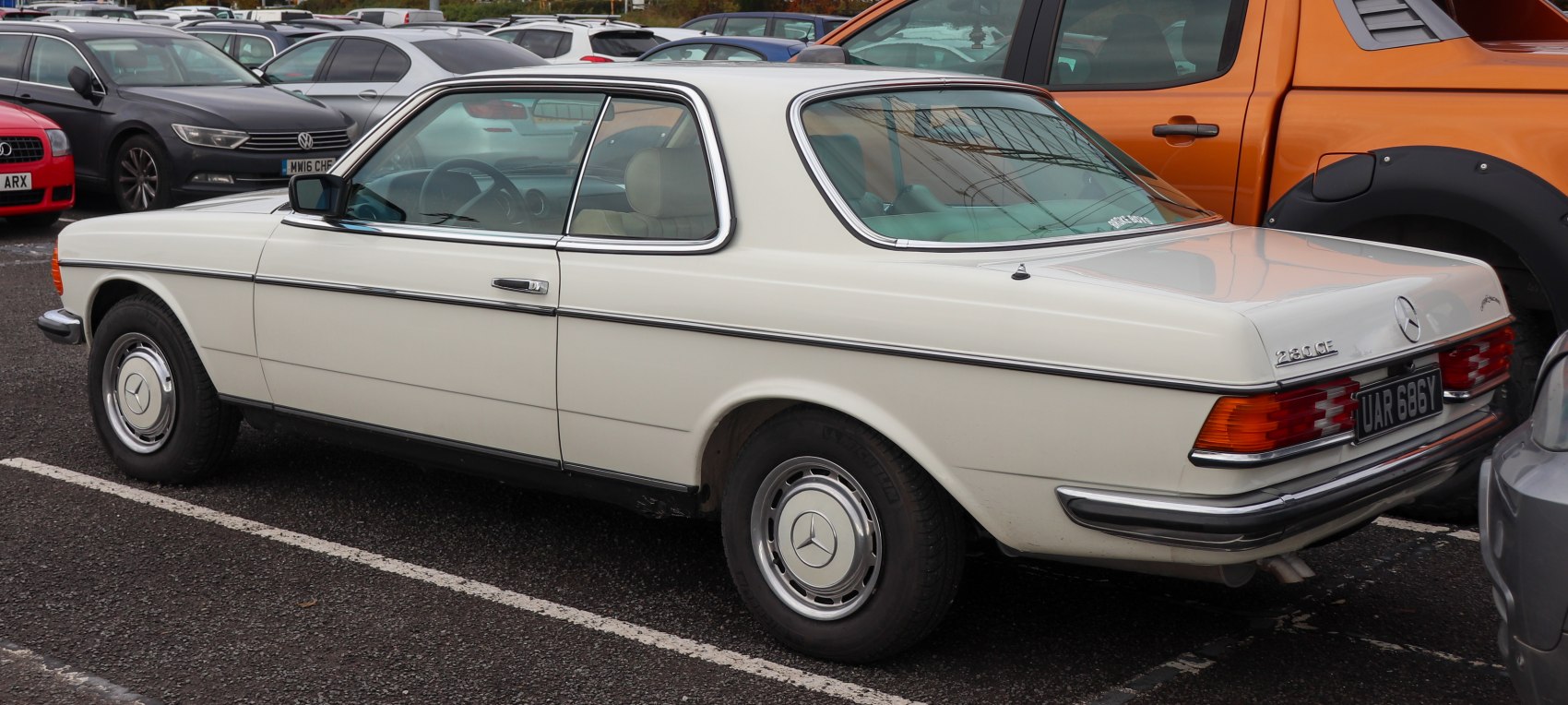 Vintage two-door coupe with chrome trim and classic hubcaps