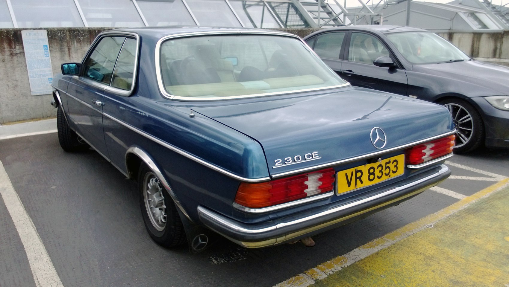 Classic coupe rear with taillights and chrome trim