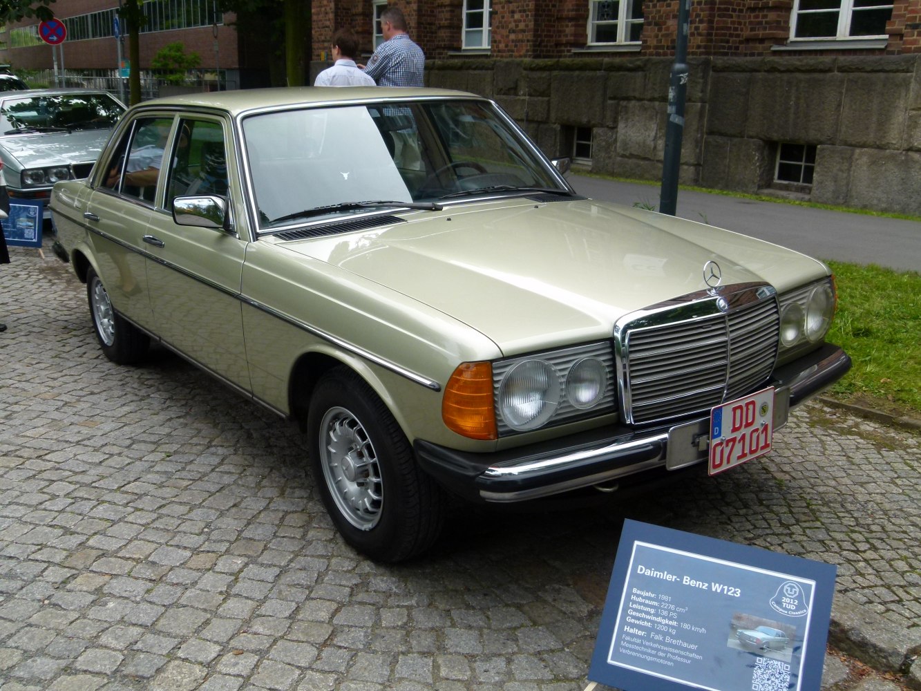 Luxury sedan front view with dual round headlights and classic chrome grille