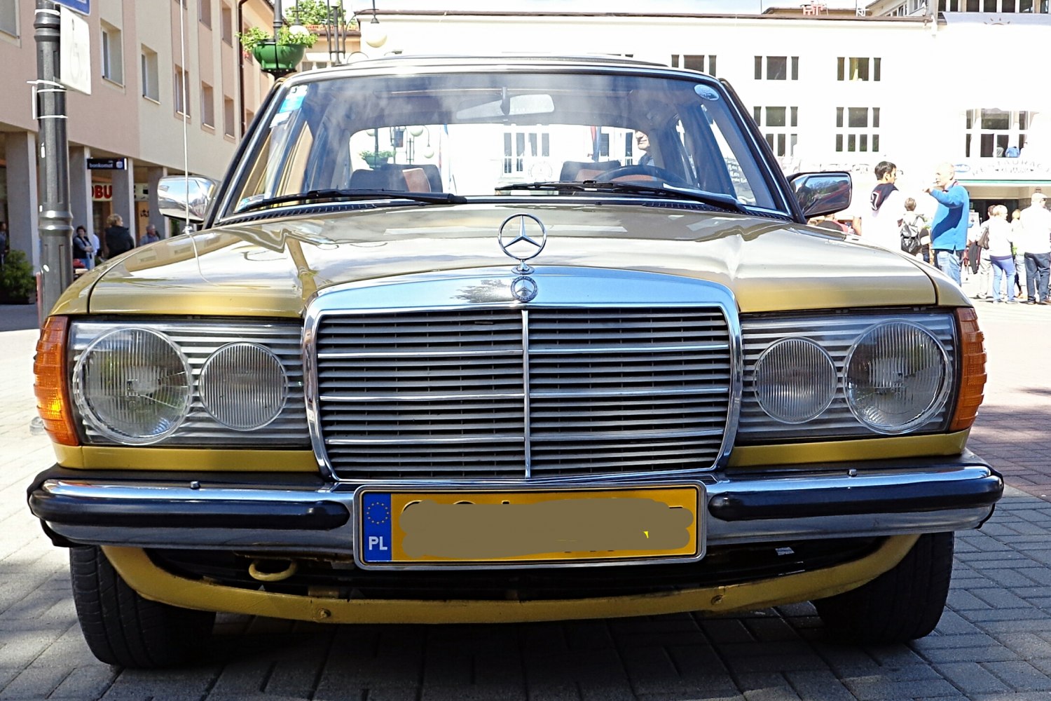 Front view with chrome grille and dual round headlights