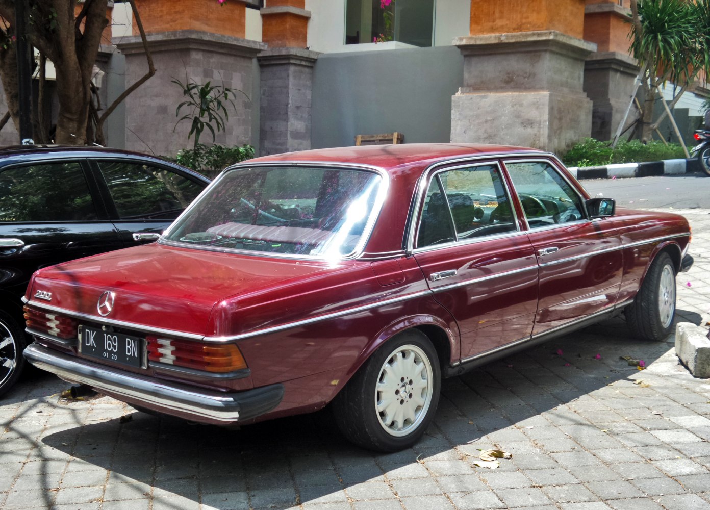 Rear view of classic luxury sedan with vintage tail lights and smooth bodywork