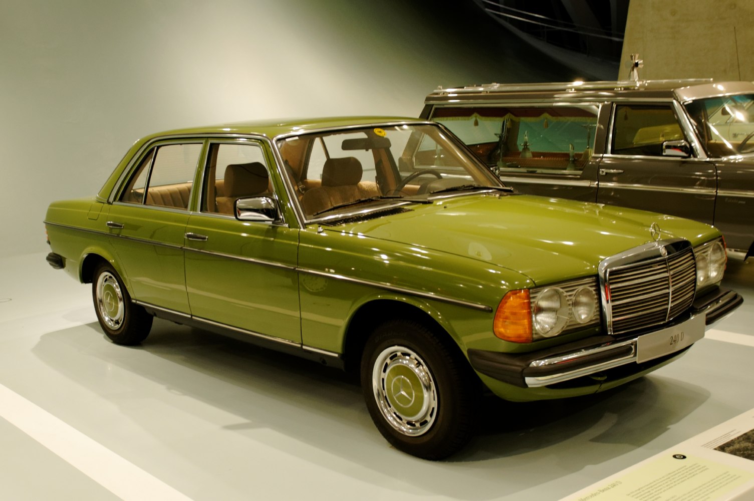Vintage classic sedan front side in green with chrome accents