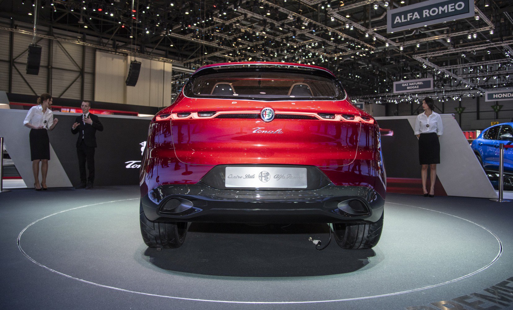 Rear view of a car with sleek, modern taillights and a smooth curved design.