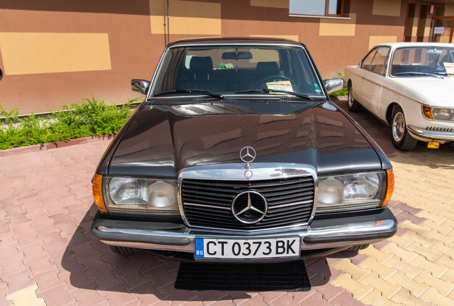 Front view with classic grille and rectangular headlights