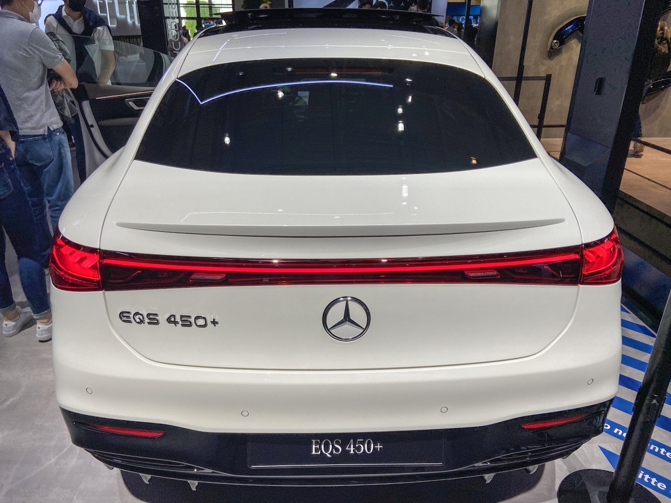Rear view with continuous LED tail light and rear spoiler.