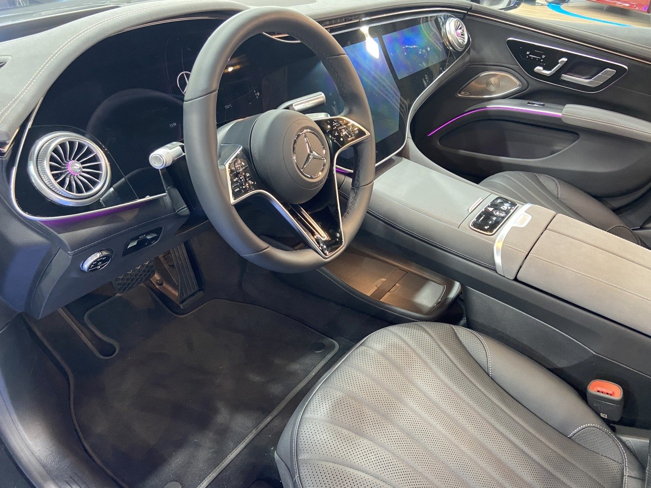 Luxury digital dashboard and steering wheel with ambient lighting